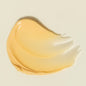 Swatch of beige cream on a light beige background