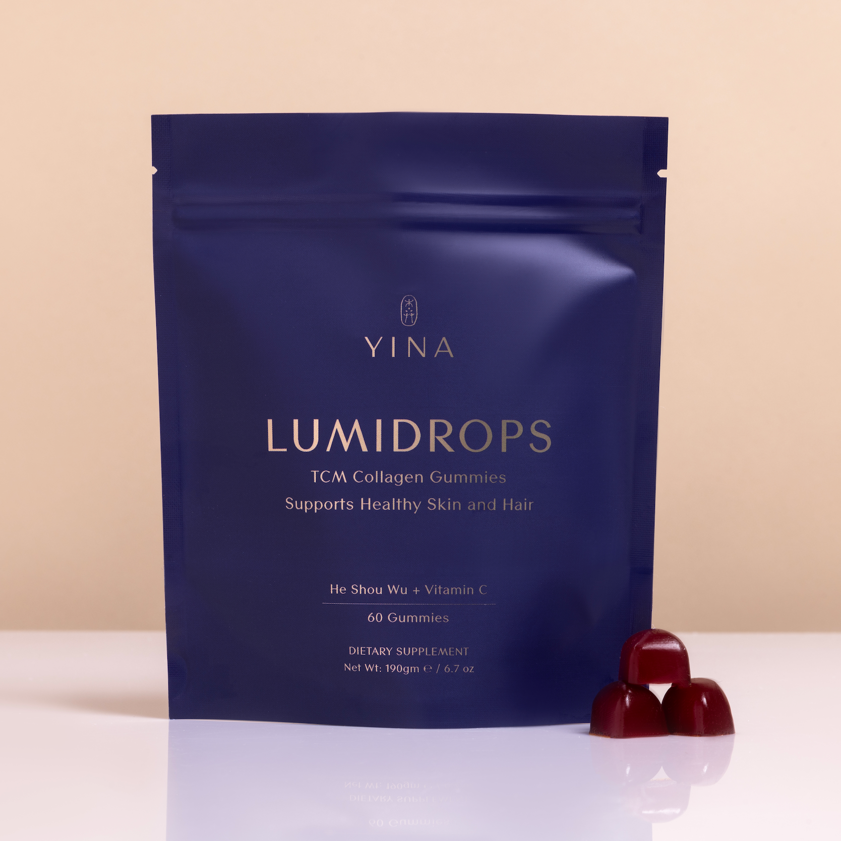 YINA Lumidrops package with two red gummies on a clean background